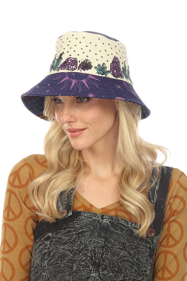 Woman wearing a cotton stones bucket hat with crystal and stone patterns, made in Nepal