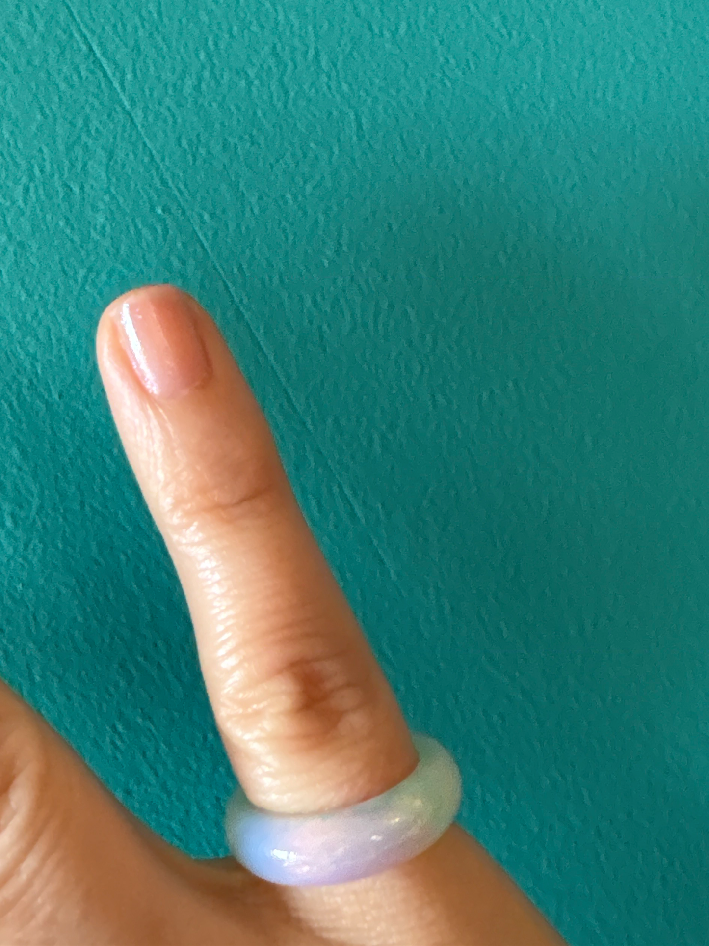 Opalite ring on a finger promoting calmness and inner peace