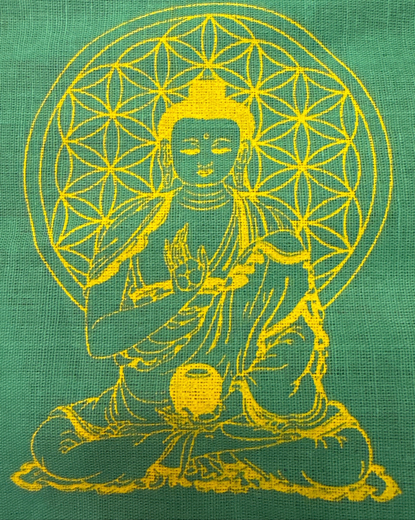 Green Buddha prayer flag with yellow Buddha illustration and geometric halo design