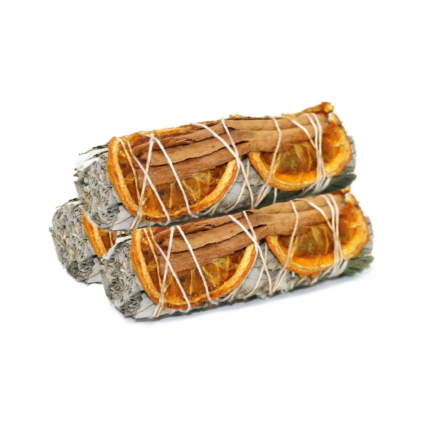 Four white sage smudge sticks bundled with cinnamon sticks and dried orange slices for spiritual cleansing and abundance.