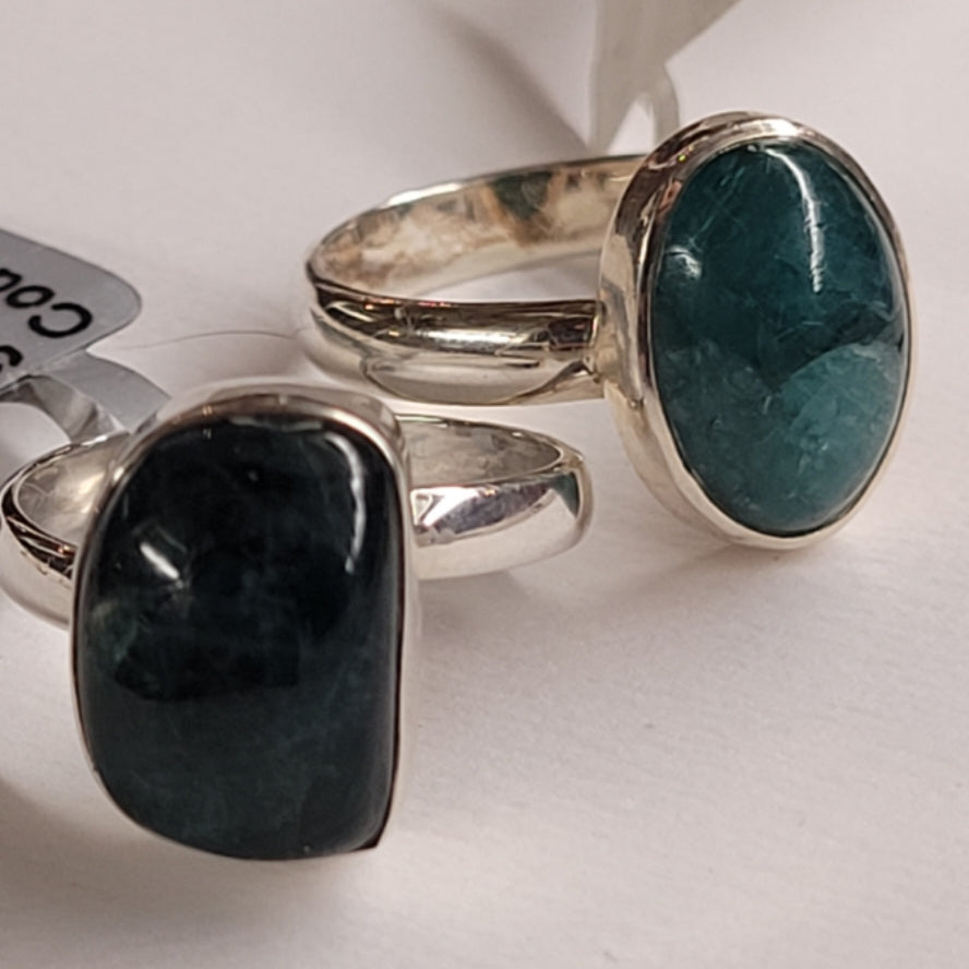 Ring Grandidierite with oval and rectangular blue-green gemstones set in silver bands