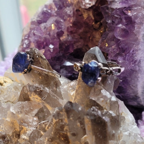 Dumortierite Ring with rich blue stone set in silver on crystal and amethyst background