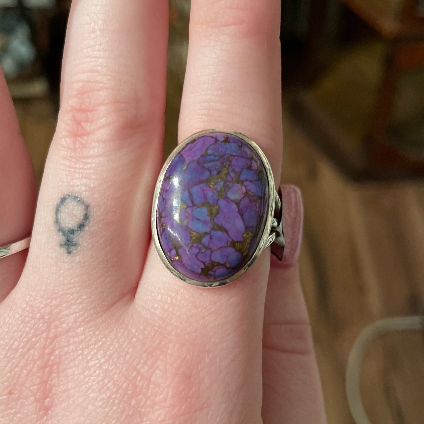 Ring with a round purple turquoise stone size 9 on finger with silver band