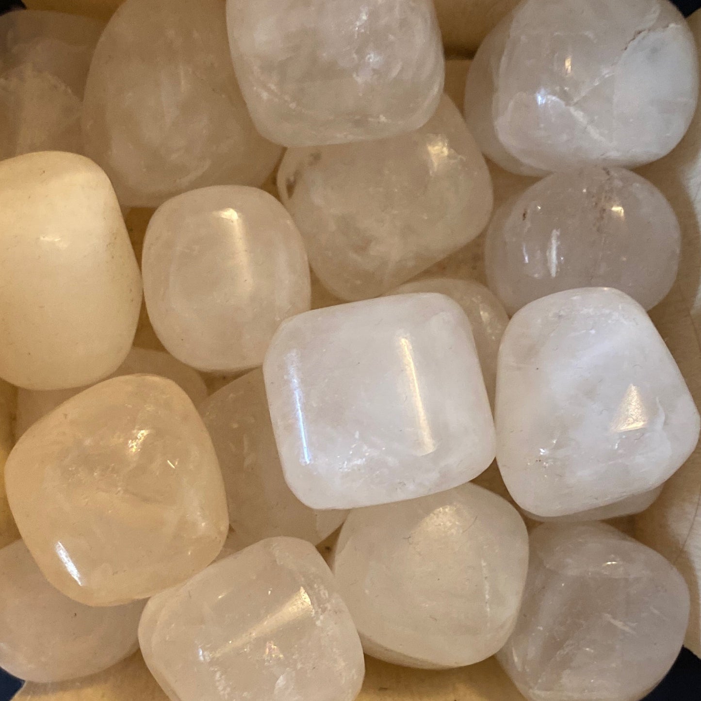 Tumbled phantom quartz stones with unique natural inclusions in a polished finish