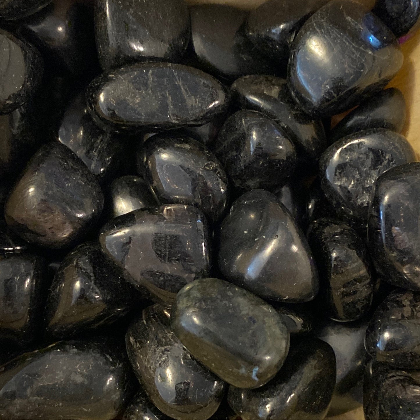 Polished black Hypersthene tumbles enhancing inner strength and confidence crystal stones
