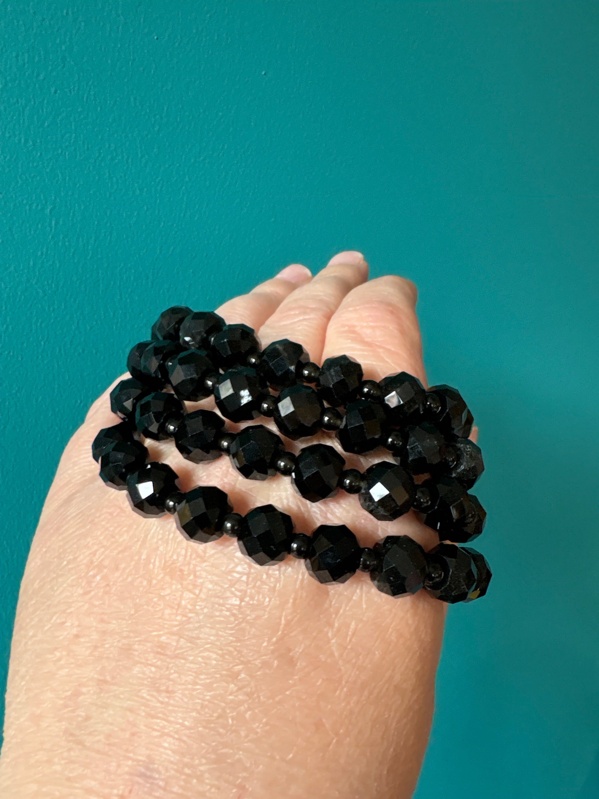 Bracelet Black Obsidian faceted 8mm beads promoting grounding and protection against negative energy