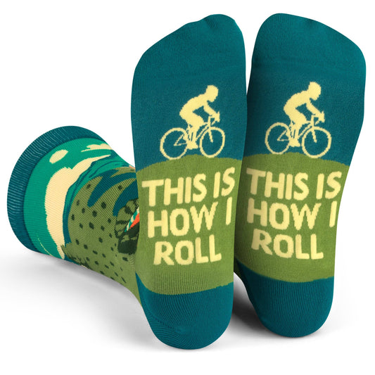 Unisex crew length roll bike socks with cyclist design and "This is How I Roll" message on soles in teal and green colors