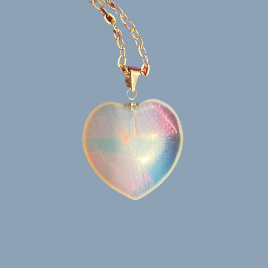 Opalite heart pendant on gold chain showcasing iridescent healing gemstone jewelry