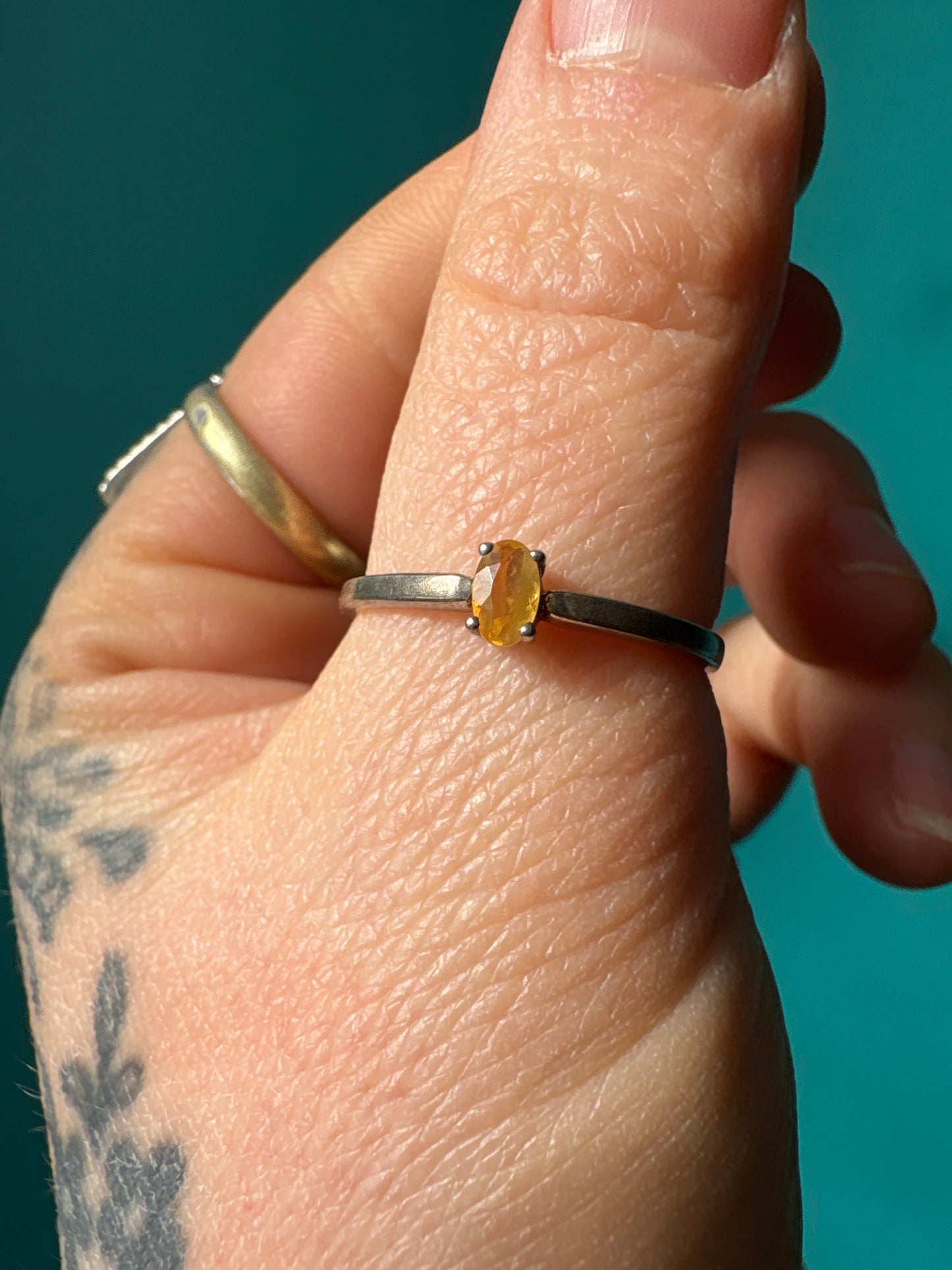 Ring Mexican Fire Opal Oval with oval orange fire opal stone on silver band worn on finger