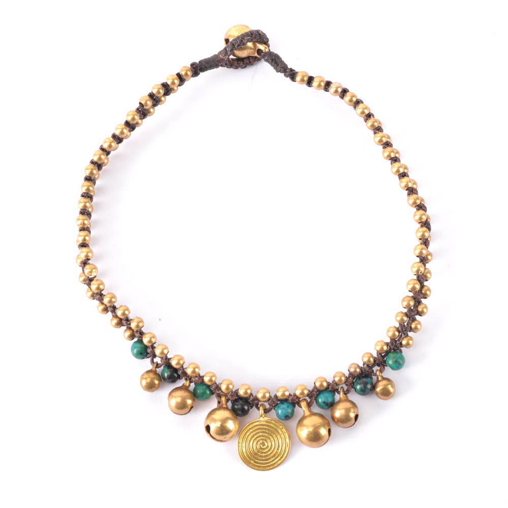 Bronze one strand anklet with swirl design, gold beads, and green accents by Benjamin International, inspired by Nepal, Indonesia, and India.