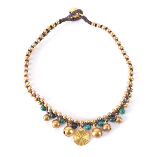 Bronze one strand anklet with swirl design, gold beads, and green accents by Benjamin International, inspired by Nepal, Indonesia, and India.