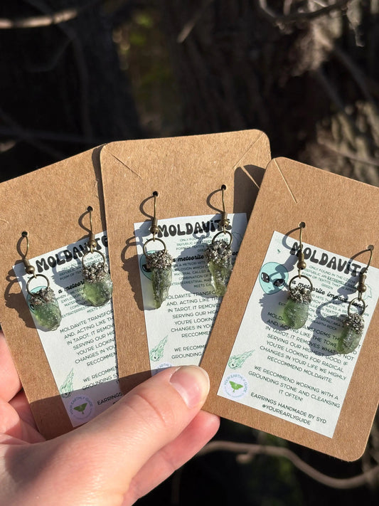 Moldavite and Pyrite earrings featuring green Moldavite and metallic Pyrite stones for spiritual transformation and grounding