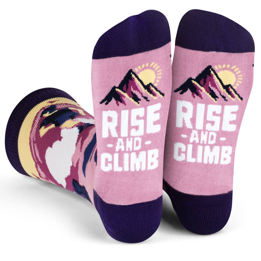 Purple crew length socks with "Rise and Climb" text, mountain and floral hiking design made from cotton blend