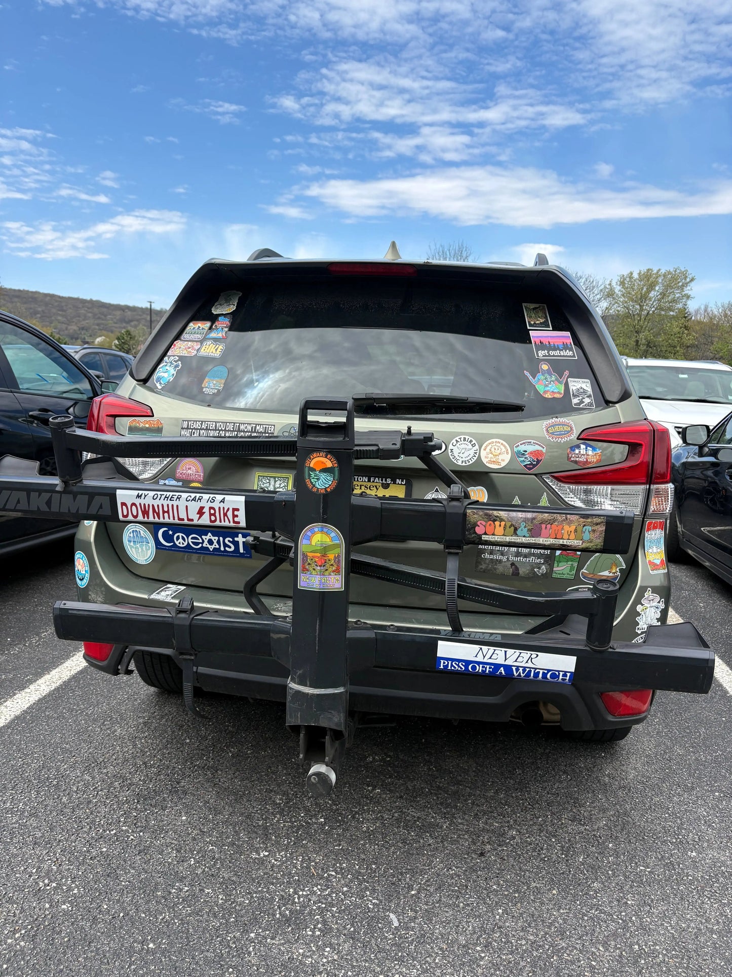 Soul & Summit Bumper Sticker with rainbow logo and forest backdrop on weather-resistant vinyl