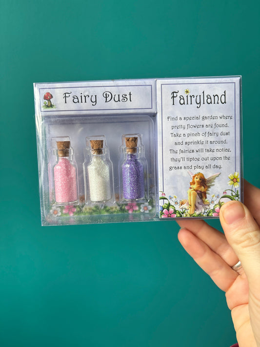 Set of three 6cm Fairy Jar Ornaments filled with pink, white, and purple fairy dust glitter with a magical wishing scroll and fairyland packaging