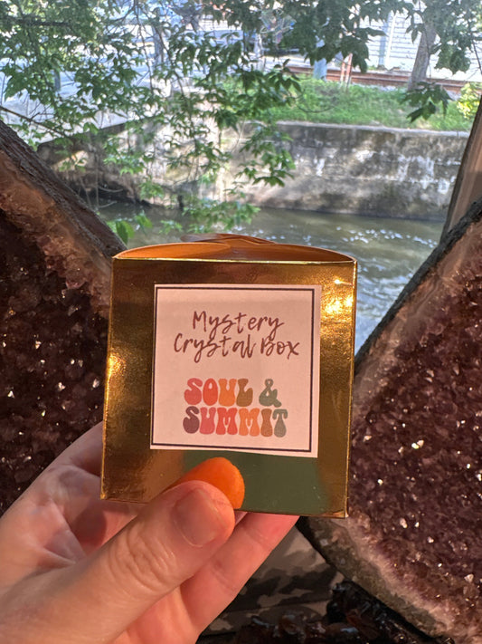 Mystery Crystal Gift Box by Soul & Summit held in hand with natural outdoor background