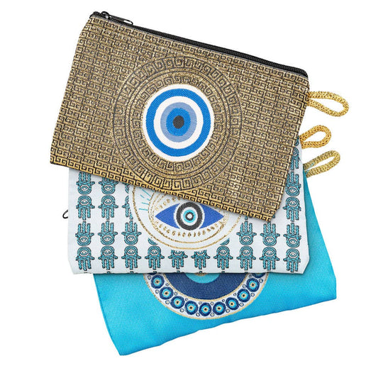 Assorted evil eye coin purses with intricate global-inspired designs and zippers