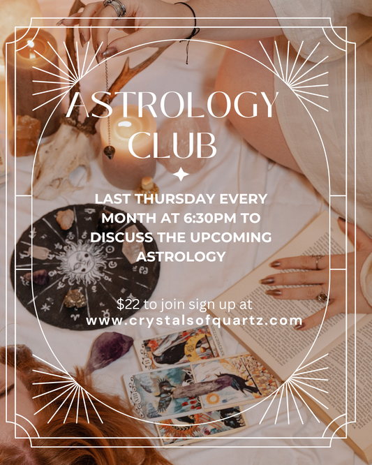 Astrology Club monthly meeting announcement with tarot cards and crystals on table