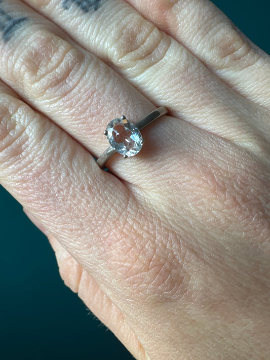 Ring Quartz Crystal Size 10 with clear oval quartz stone set on silver band worn on finger