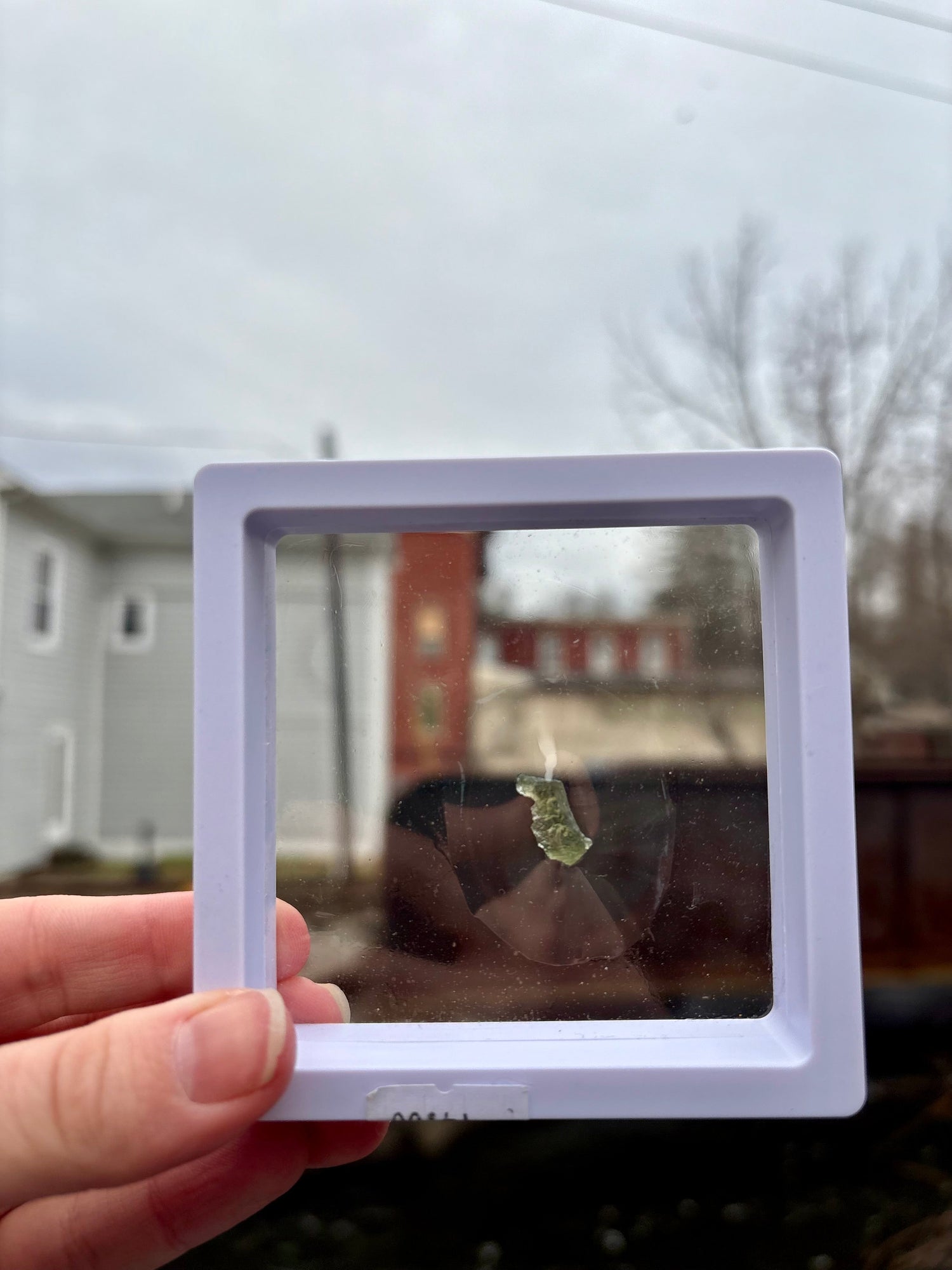 Deep green Moldavite stone from Czech Republic, rare meteorite impact tektite known for transformative spiritual energy