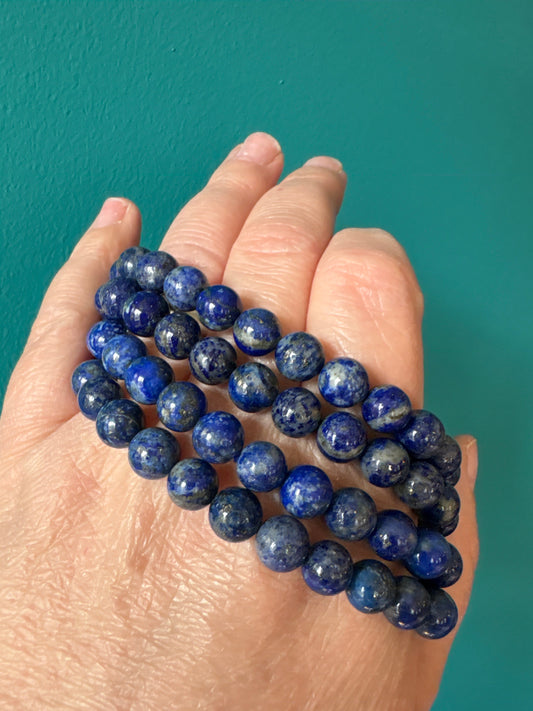 Bracelet lapis lazuli 8mm natural stone beads promoting inner peace and creativity wrapped around hand