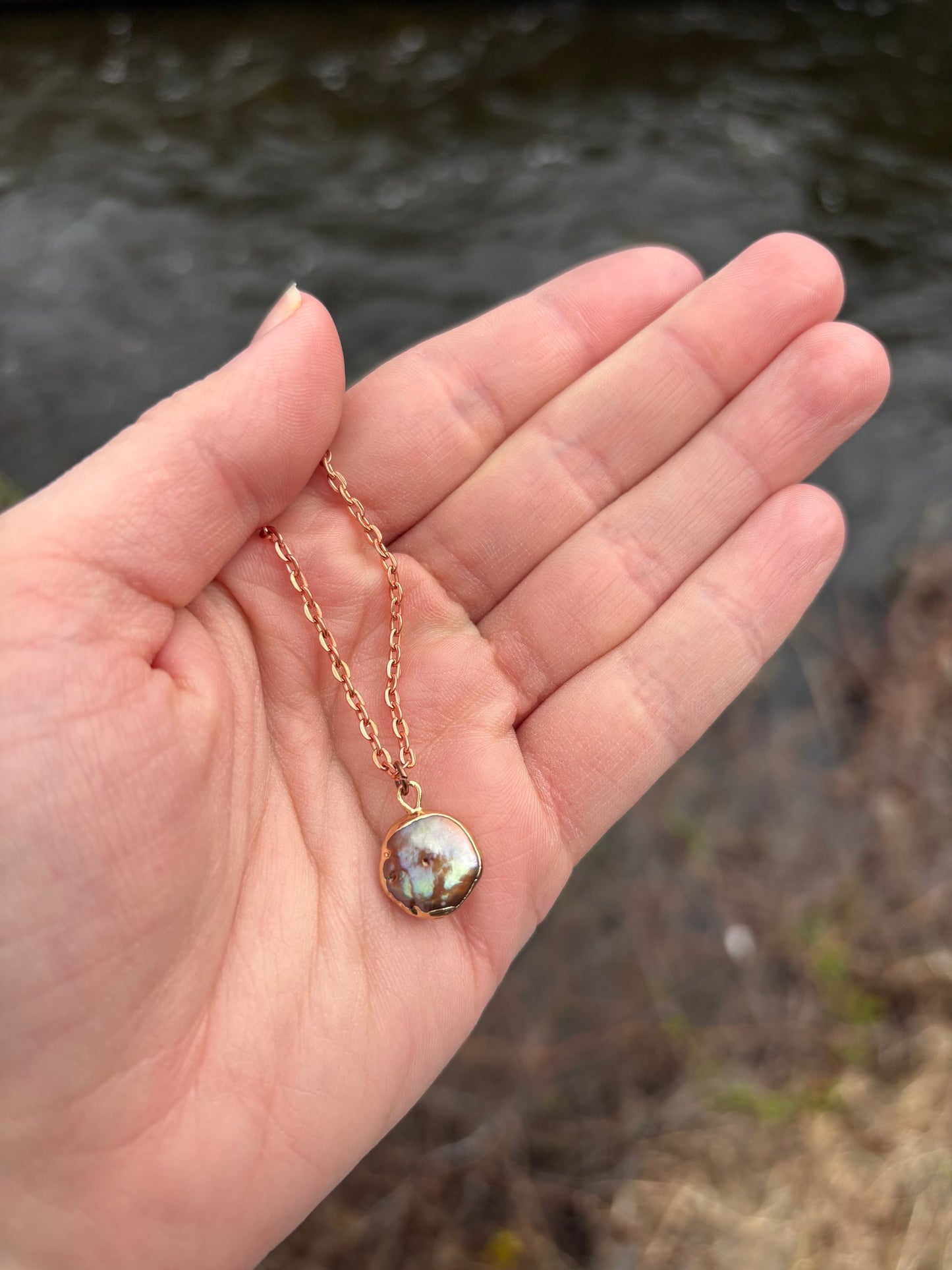 Black Lip Oyster pearl necklace with rose gold chain and iridescent black pearl pendant