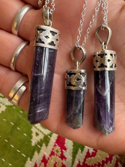 Amethyst polished point pendant showcasing natural purple crystal for spiritual growth and elegance