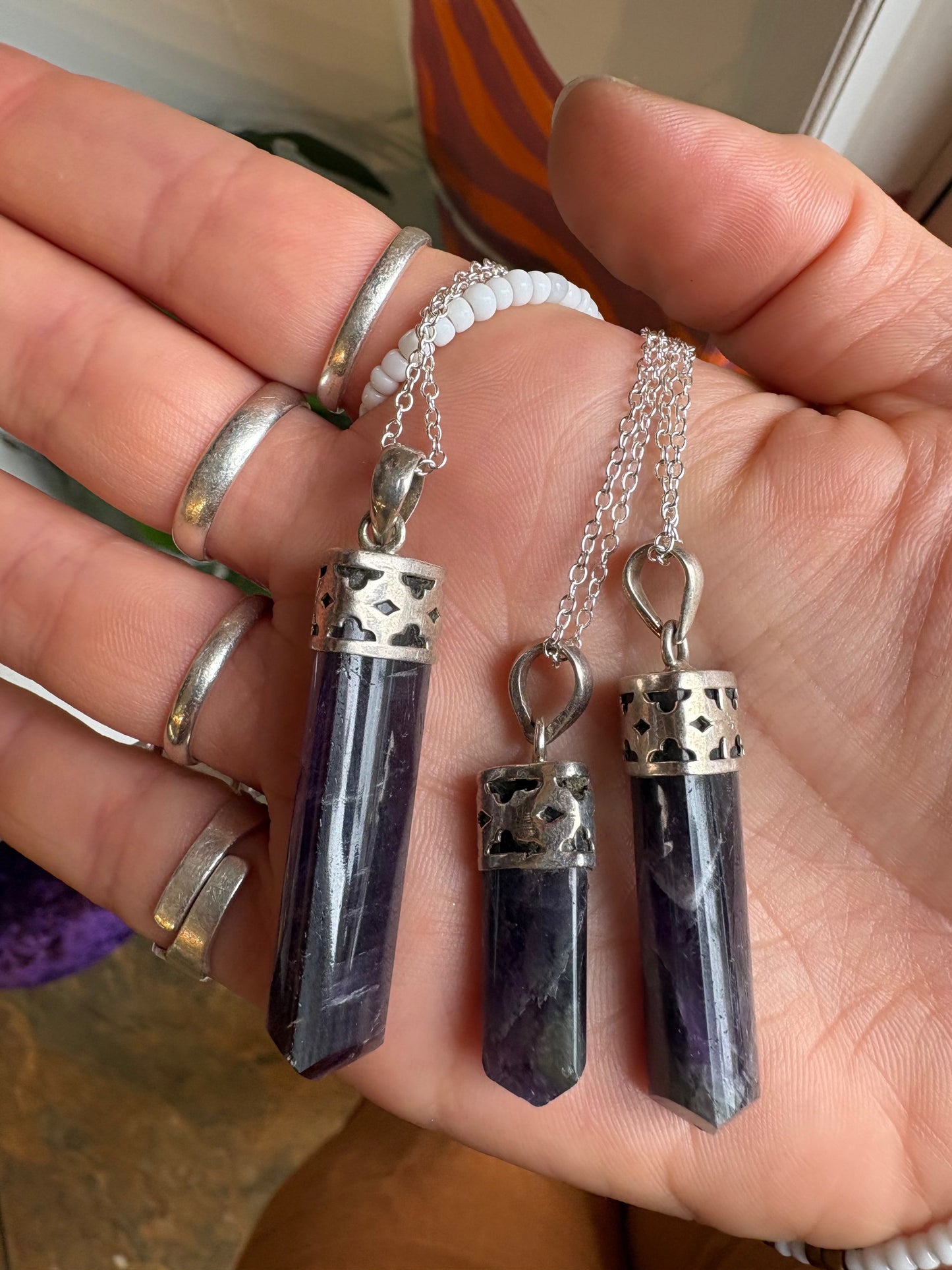 Amethyst polished point pendant showcasing natural purple crystal for spiritual growth and inner peace