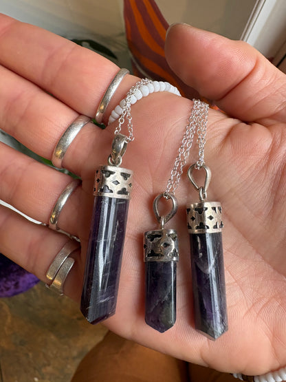 Amethyst polished point pendant showcasing natural purple crystal for spiritual growth and inner peace