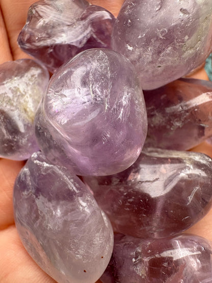 Amethyst Tumble stone promoting relaxation and well-being with natural healing properties