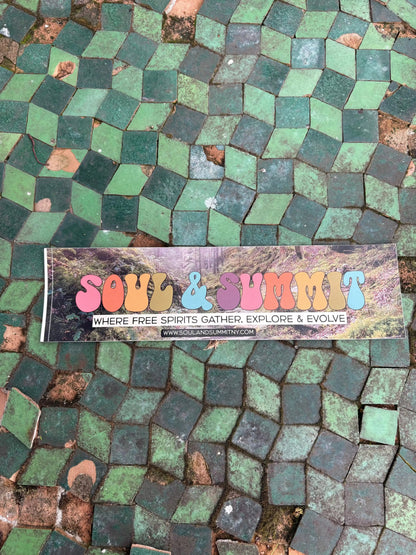 Soul & Summit Bumper Sticker with rainbow logo and forest backdrop on weather-resistant vinyl