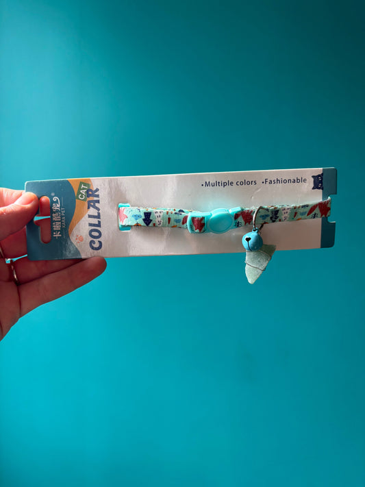 Fashionable cat collar with crystal and bell on colorful adjustable strap in packaging
