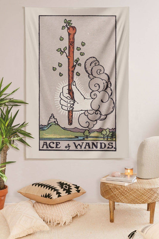 Ace of Wands tarot card tapestry with sprouting wand design hanging on wall in modern room with plants and cozy decor Wands Tapestry