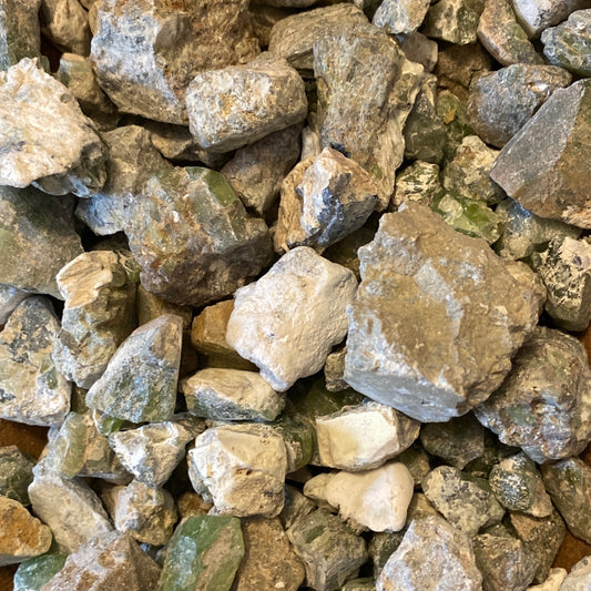 Raw Peridot tumbles with vibrant green hues and natural rough texture for jewelry and crystal collections