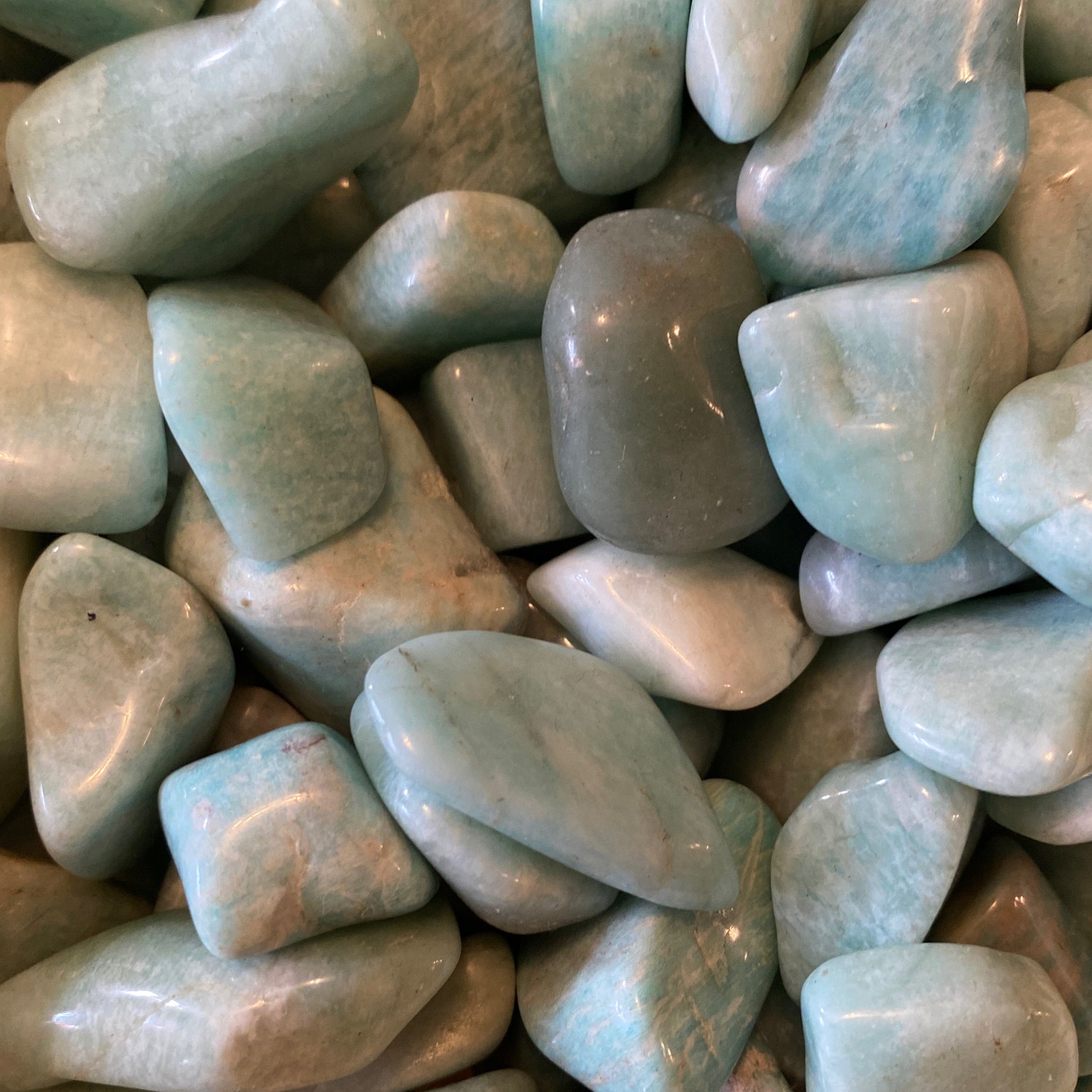 Smooth polished Amazonite tumble stones in soothing blue-green shades for calming and balance