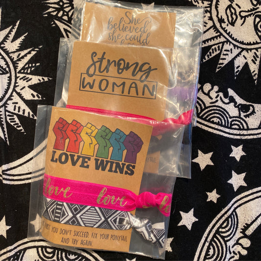 Wishlets Hair Ties set with inspirational messages and colorful designs on patterned background