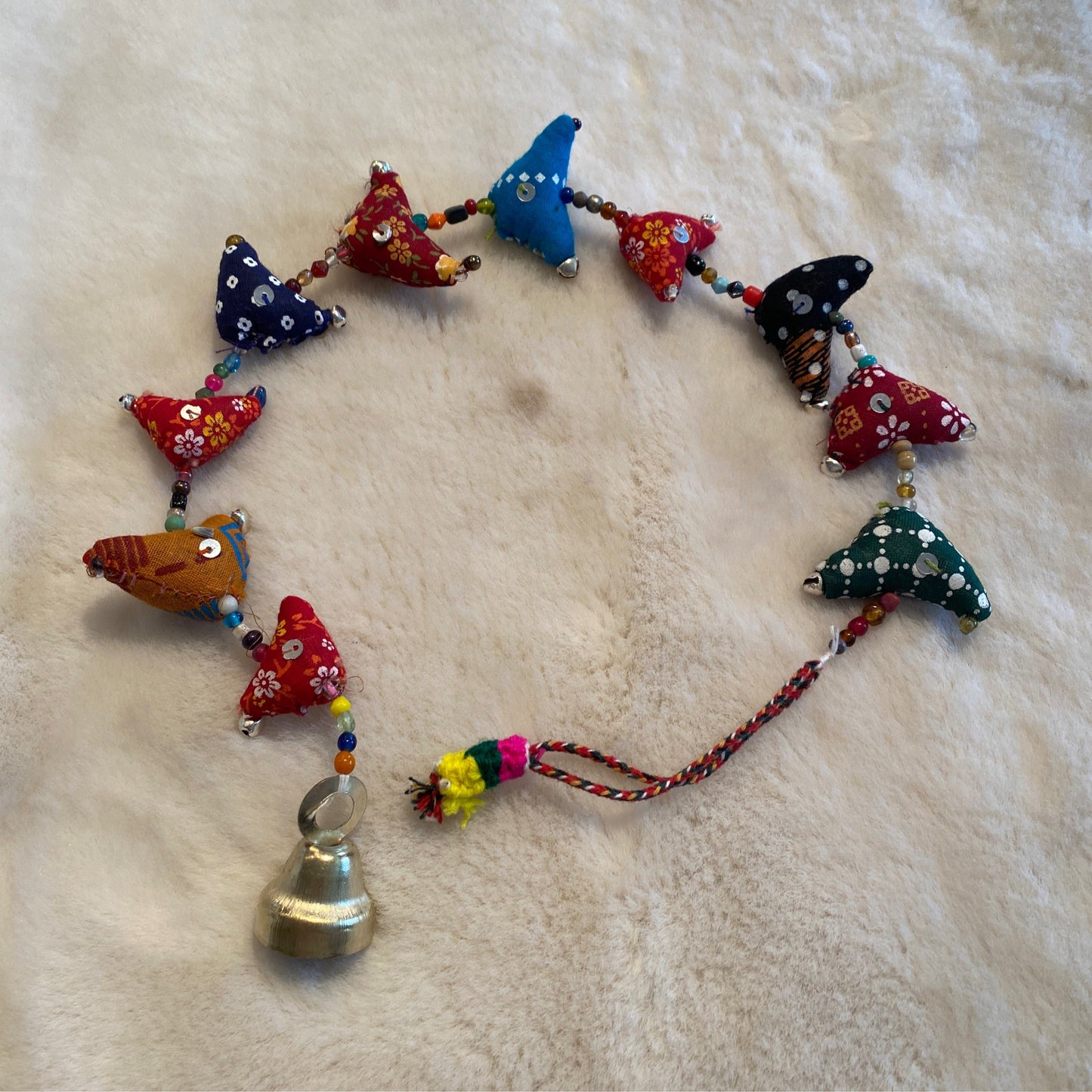 Prosperity hens handcrafted from recycled saris with colorful fabric and beads, measuring 12 inches with a hanging bell.
