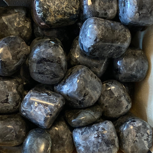 Polished larvakite tumbles with iridescent gray and black surfaces providing grounding energy and mental clarity