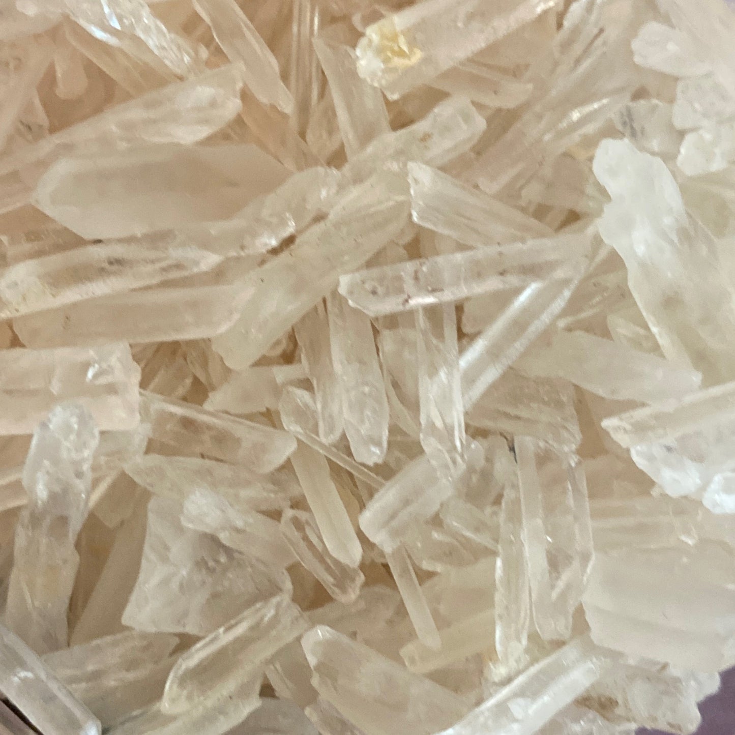 Close-up of translucent Matchstick Quartz crystals with elongated shapes and clear texture