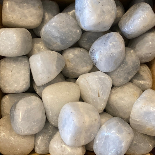 Tumbled blue calcite stones with smooth surfaces promoting relaxation and tranquility