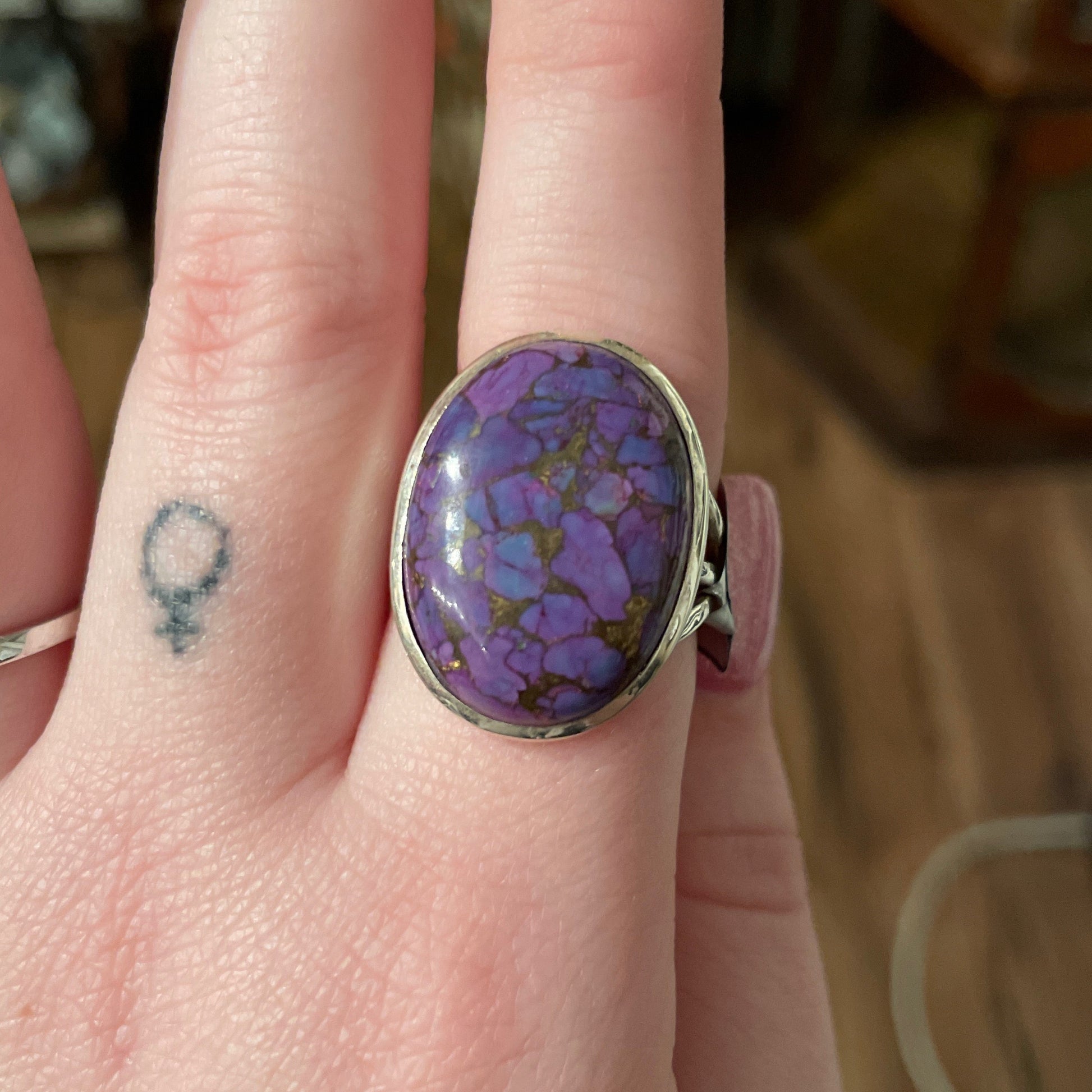 Ring with a round purple turquoise stone size 9 on finger with silver band