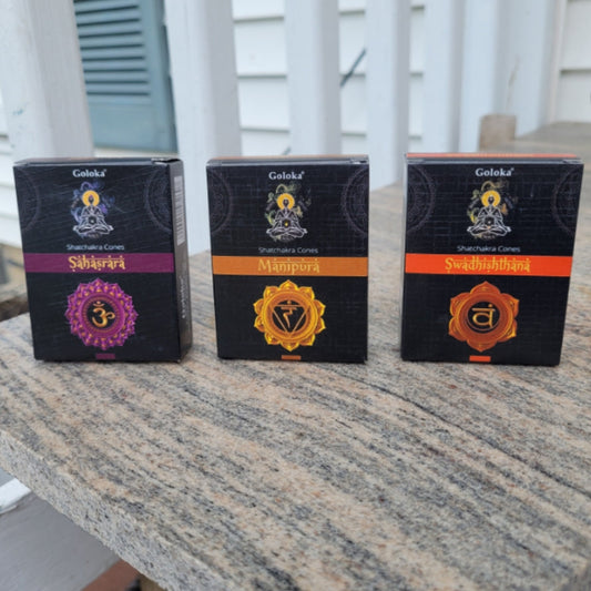 Goloka Chakra Incense Cones packaging showing Sahasrara, Manipura, and Swadhisthana chakra designs on a stone surface
