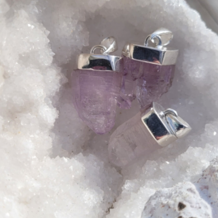 Raw Amethyst pendants with sterling silver fastening featuring unique Vera Cruz purple crystals in natural form