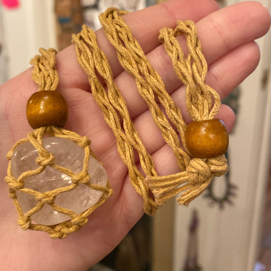 Crystal Rope Cage necklace with clear crystal held in a natural rope cage and wooden bead
