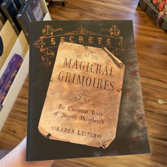 Secrets of the Magical Grimoires book cover featuring classical texts of magick deciphered by Aaron Leitch