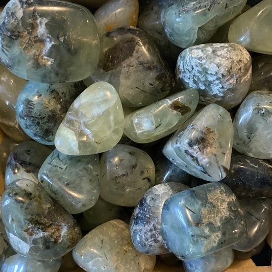 Prehnite tumble stones with translucent green and gray hues and natural inclusions