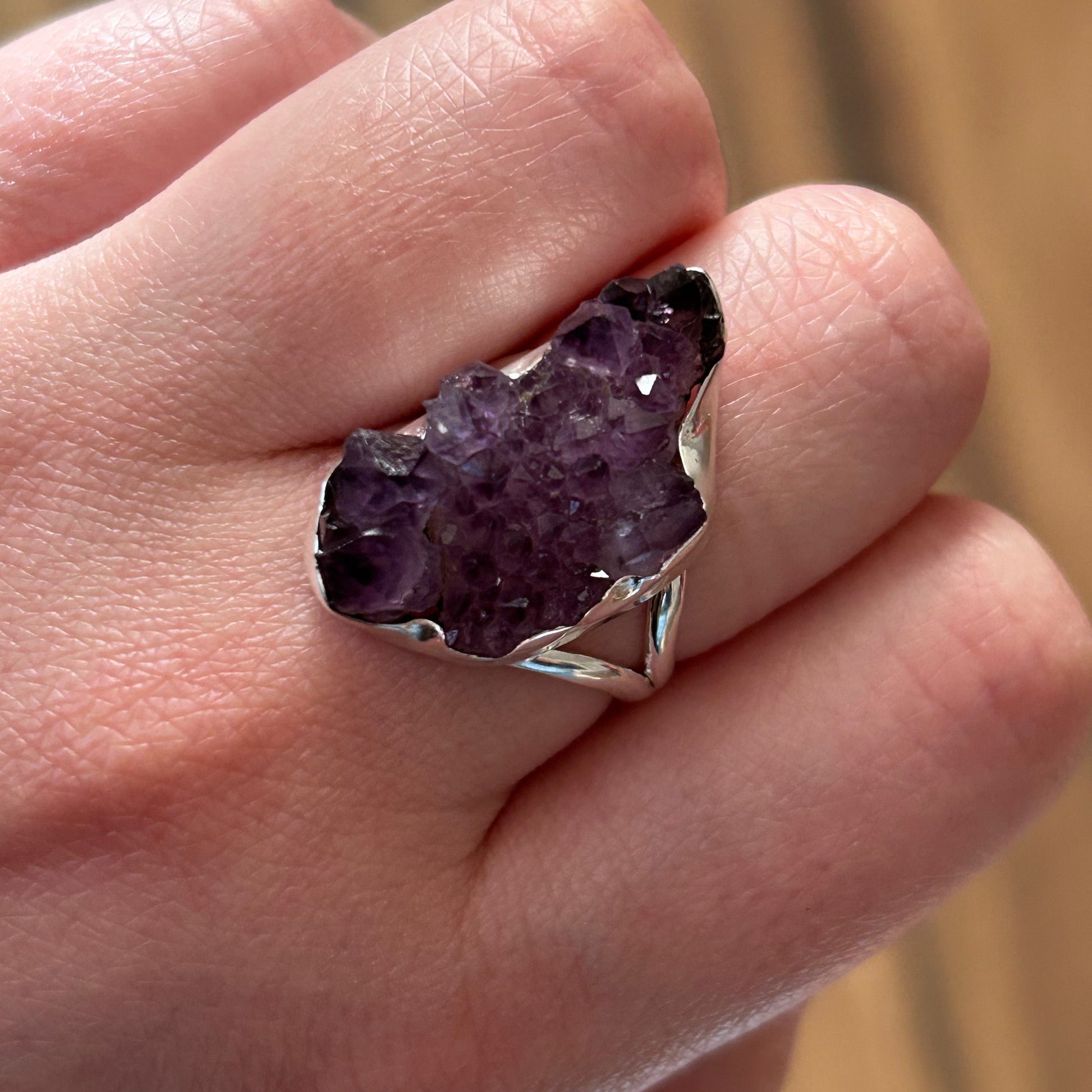 Ring Spirit Quartz ring with raw purple crystal on hand promoting healing and balance