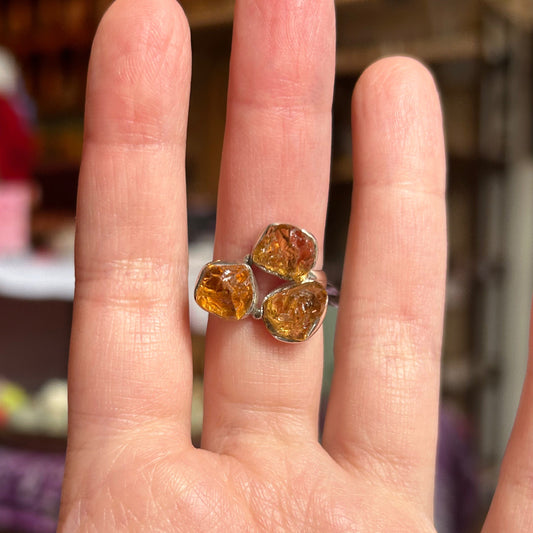 Ring Triple Citrine Stone size 6 worn on finger with three raw citrine stones in silver setting