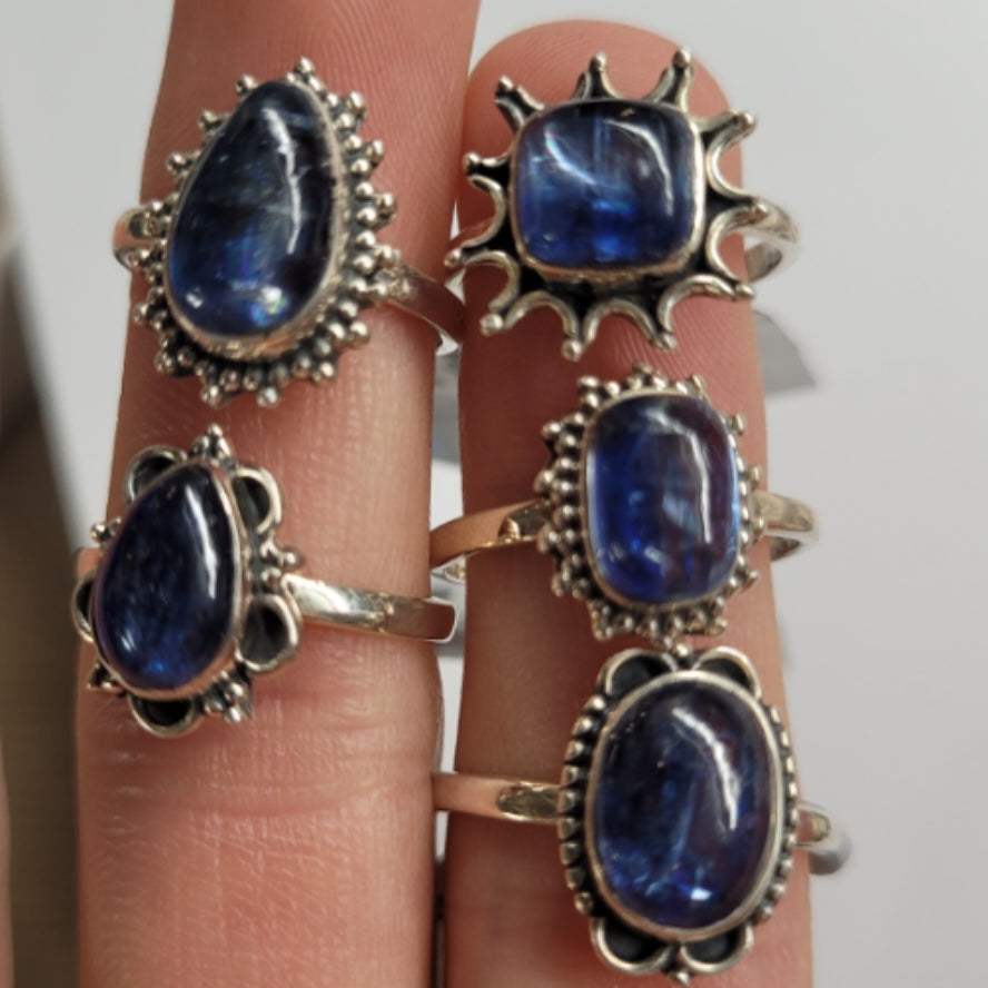 Five elegant Ring Himalayan Kyanite rings with silver settings showcasing deep blue gemstones on fingers