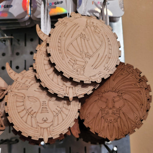Astrological signs ornament made of engraved wood with ribbon for hanging in cherry, maple, sapele, or walnut
